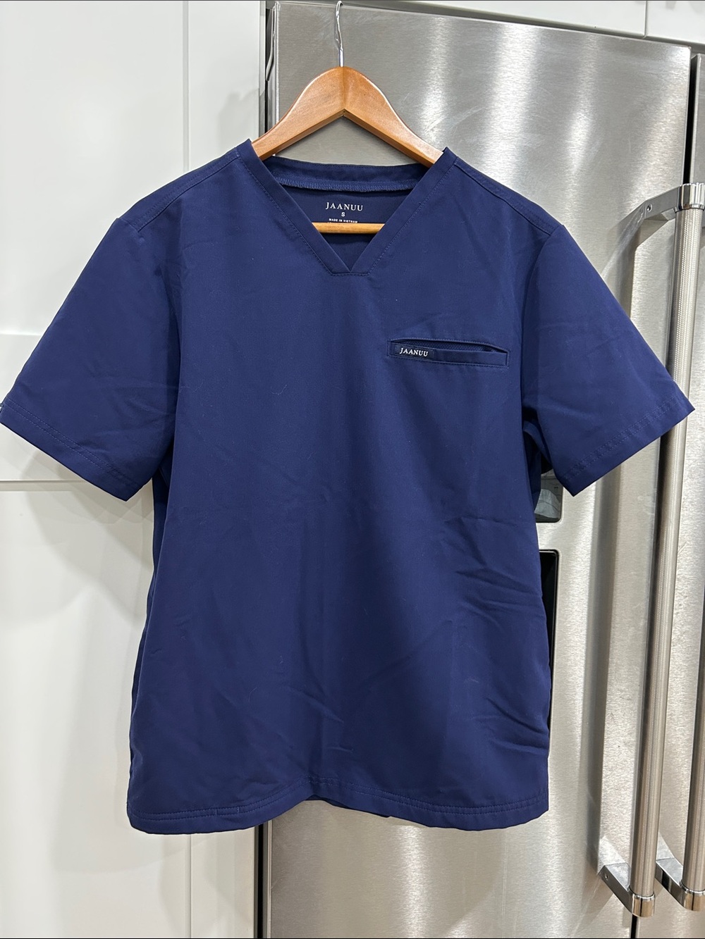 NWOT - JAANUU womenโs Navy Blue Scrub Top